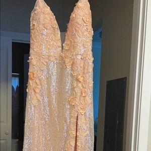 Brand new, rose gold gown. Never used!